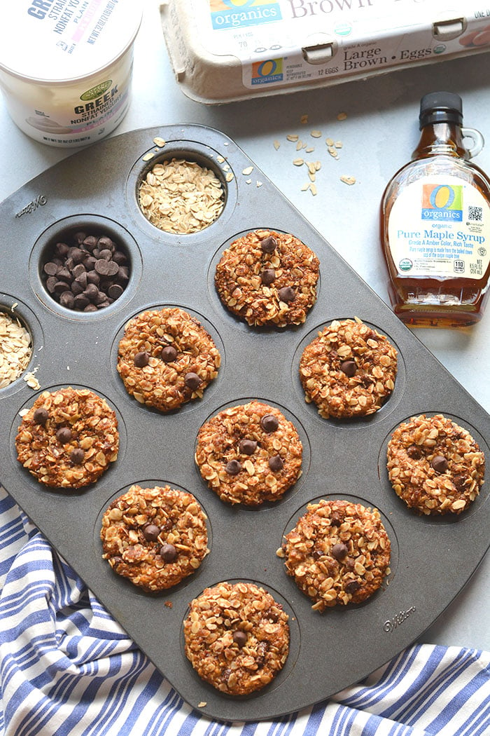 Healthy Greek Yogurt Muffins are low calorie chocolate chip muffins made with gluten free oats. Topped with a cinnamon streusel, they are a perfectly portioned snack! 
