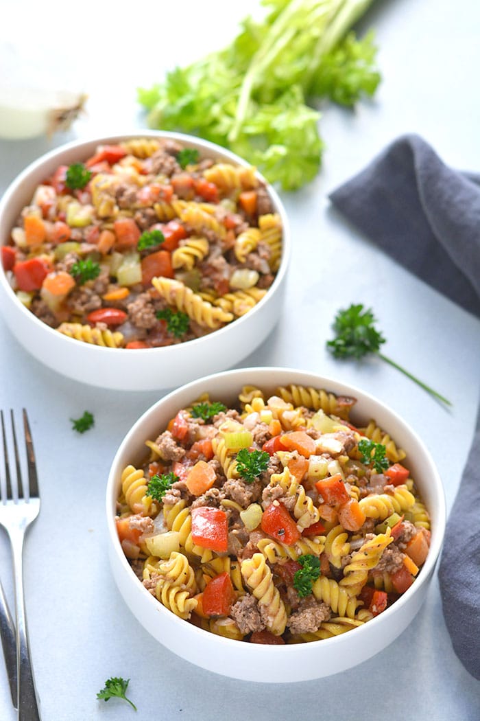 pasta and vegetables in a white bowl