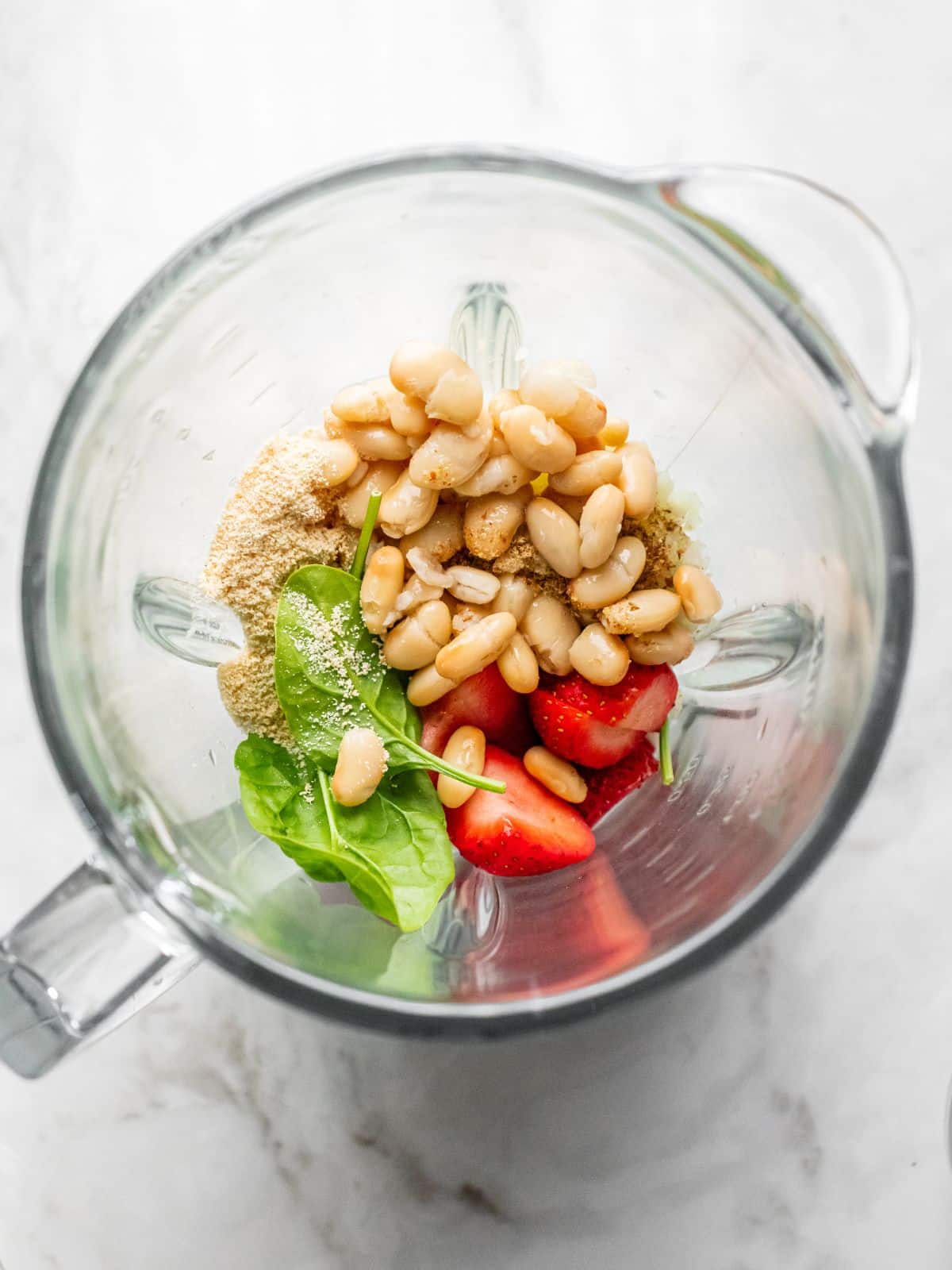 Ingredients added to a blender for a high fiber smoothie.