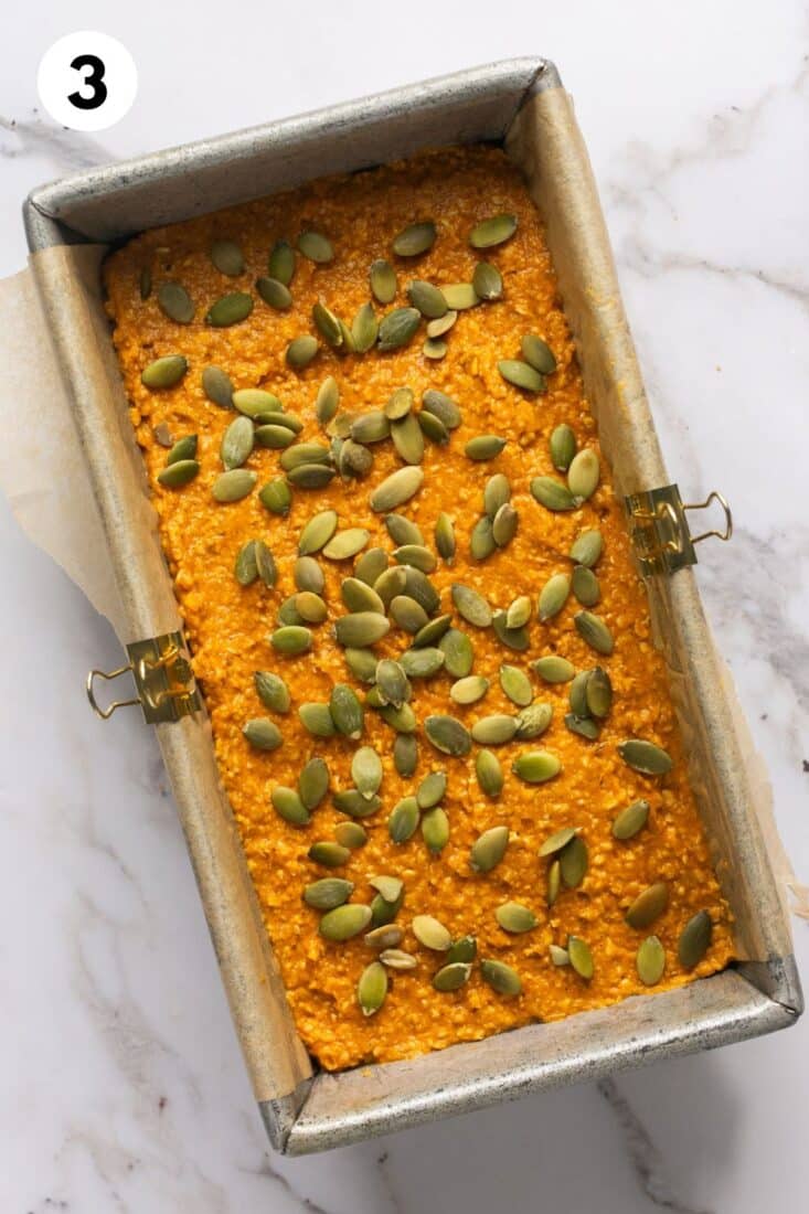 Pumpkin oat bread batter poured into a loaf pan. 