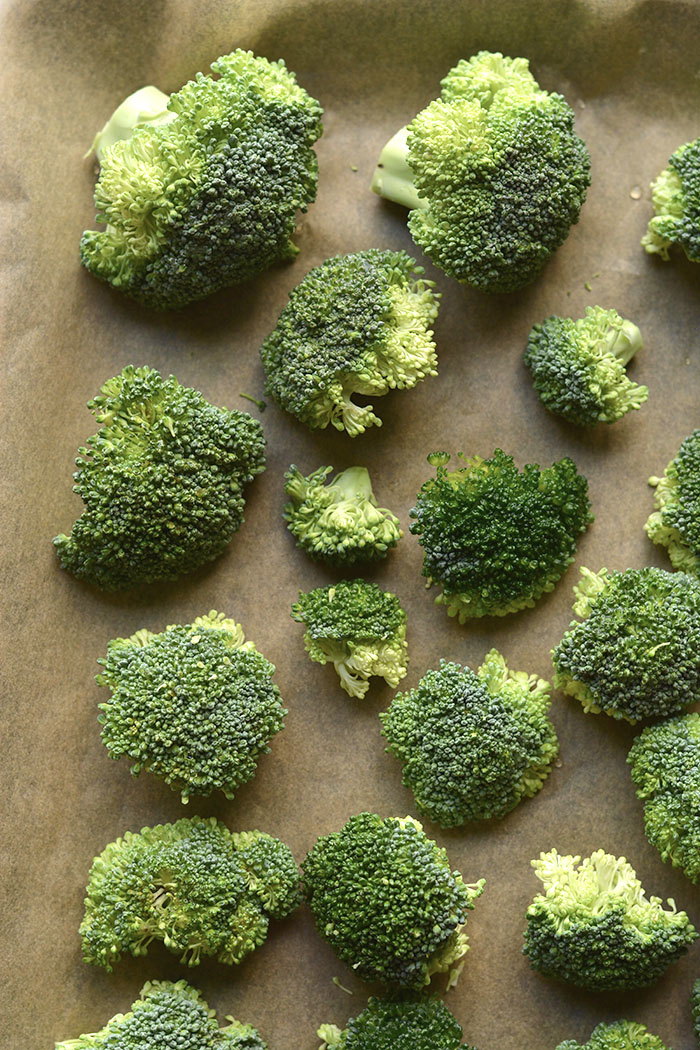 raw broccoli on a sheet pan
