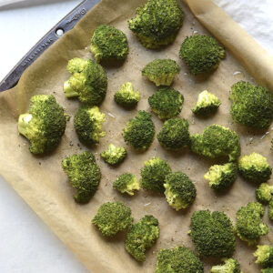 cooked broccoli on a sheet pan