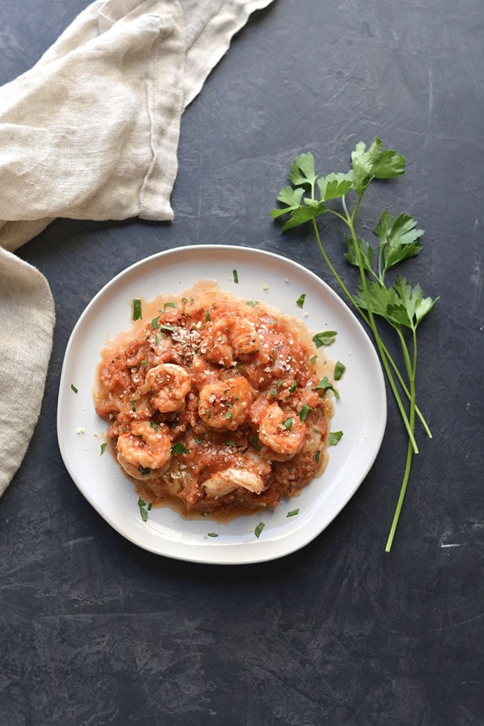 shrimp and spaghetti squash on a white plate