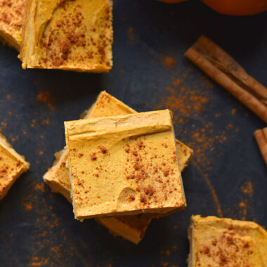 Healthy Pumpkin Cheesecake Bars is a low calorie cheesecake dessert recipe made higher protein and with a gluten free crust! Gluten Free + Low Calorie
