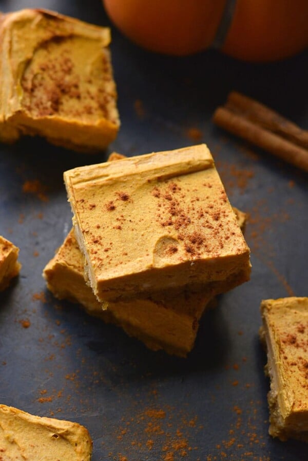 Healthy Pumpkin Cheesecake Bars is a low calorie cheesecake dessert recipe made higher protein and with a gluten free crust! Gluten Free + Low Calorie