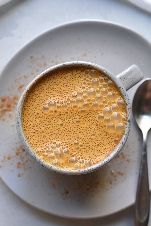 This Healthy Low Calorie Pumpkin Spice Latte recipe is made with less sugar, fewer calories and real pumpkin in under 2 minutes in a blender!