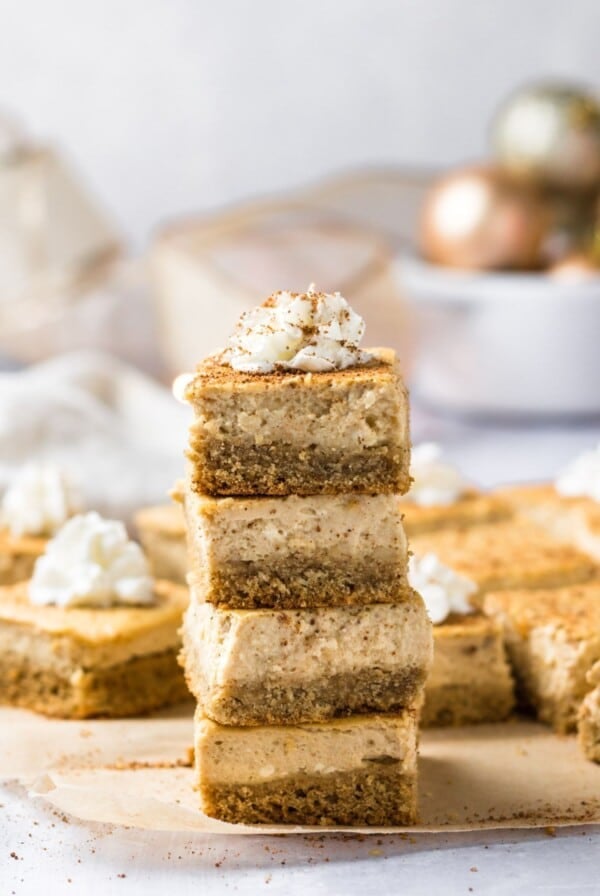 A stack of eggnog cheesecake bars.