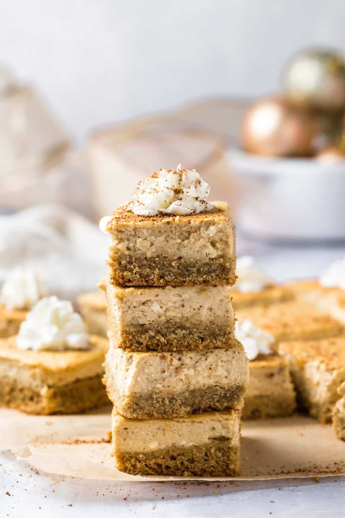 A stack of eggnog cheesecake bars.