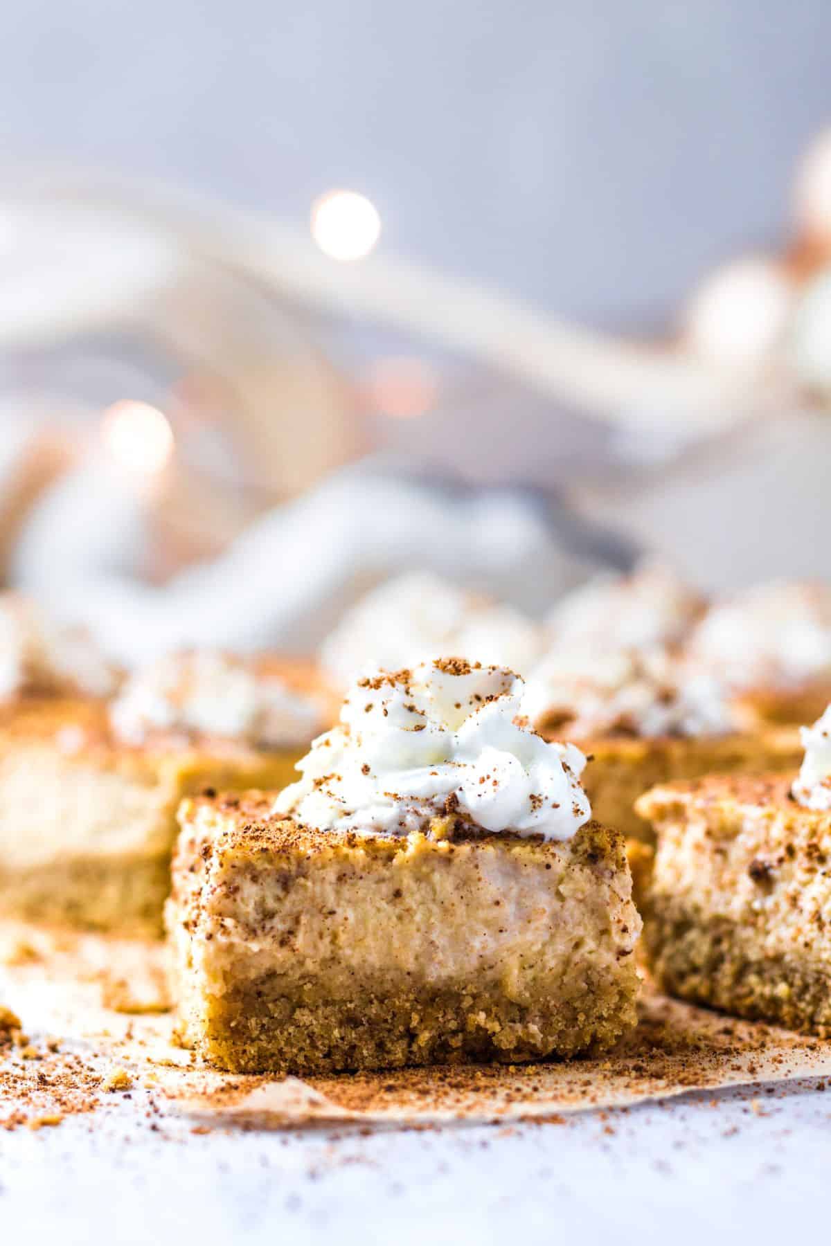 Eggnog cheesecake bars on a counter.