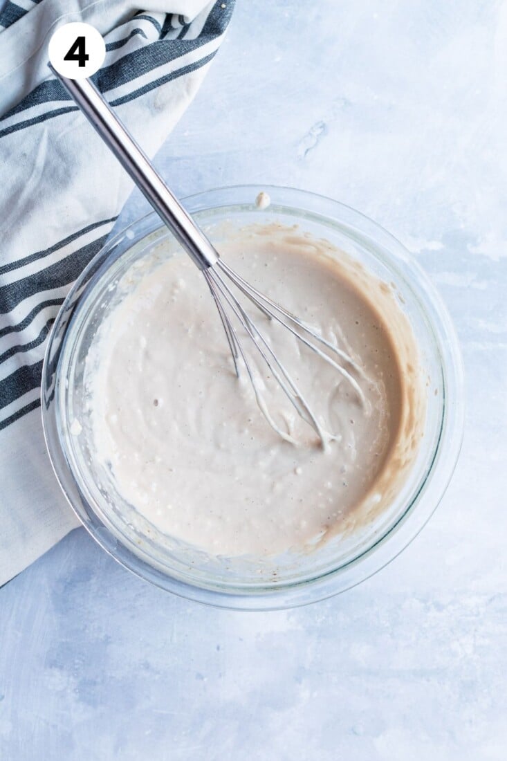 The filling for the eggnog bars whisked in a bowl.