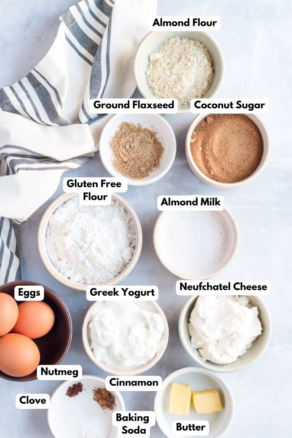 Ingredients for making eggnog cheesecake bars in bowls.