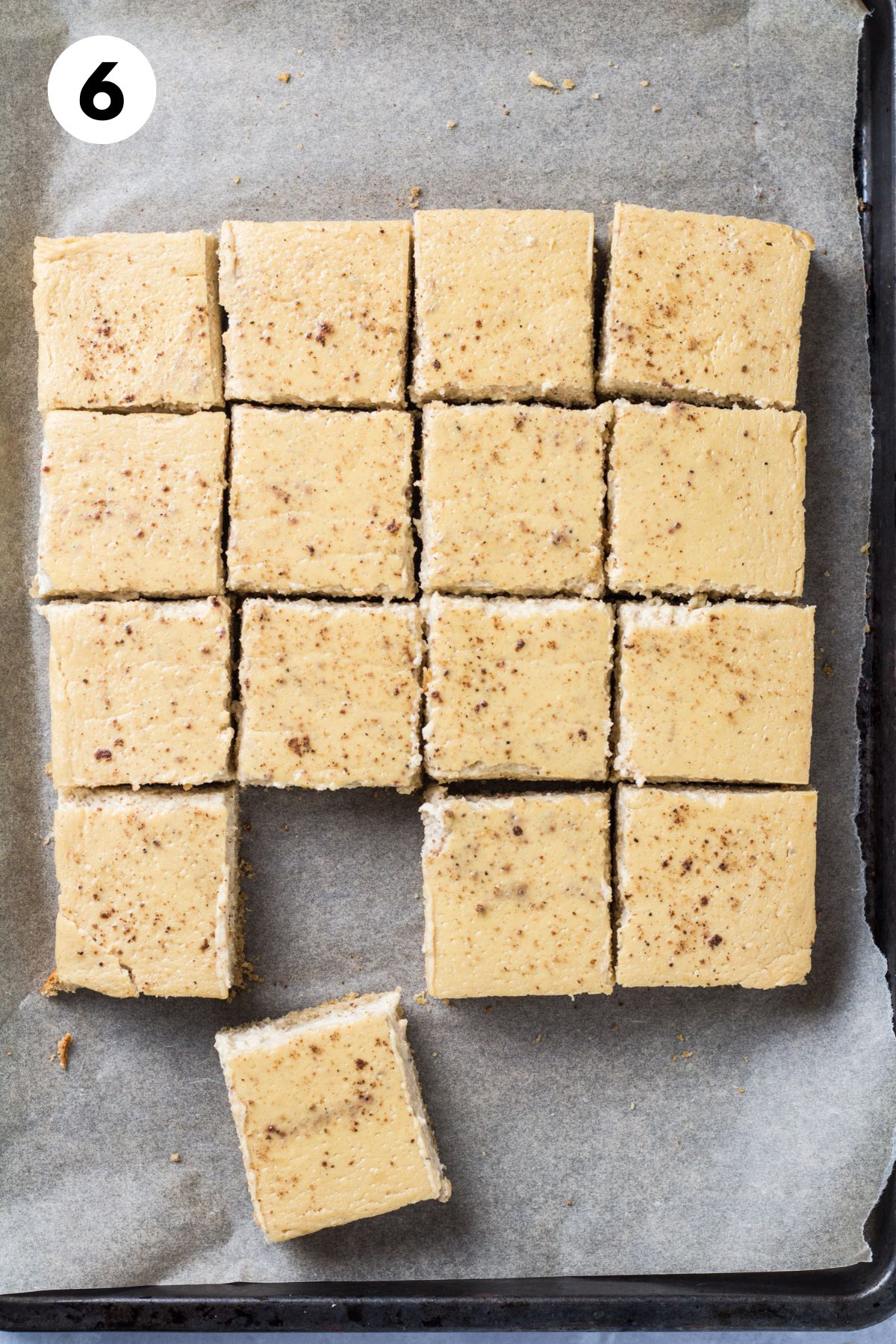 Baked and cut eggnog cheesecake bars.