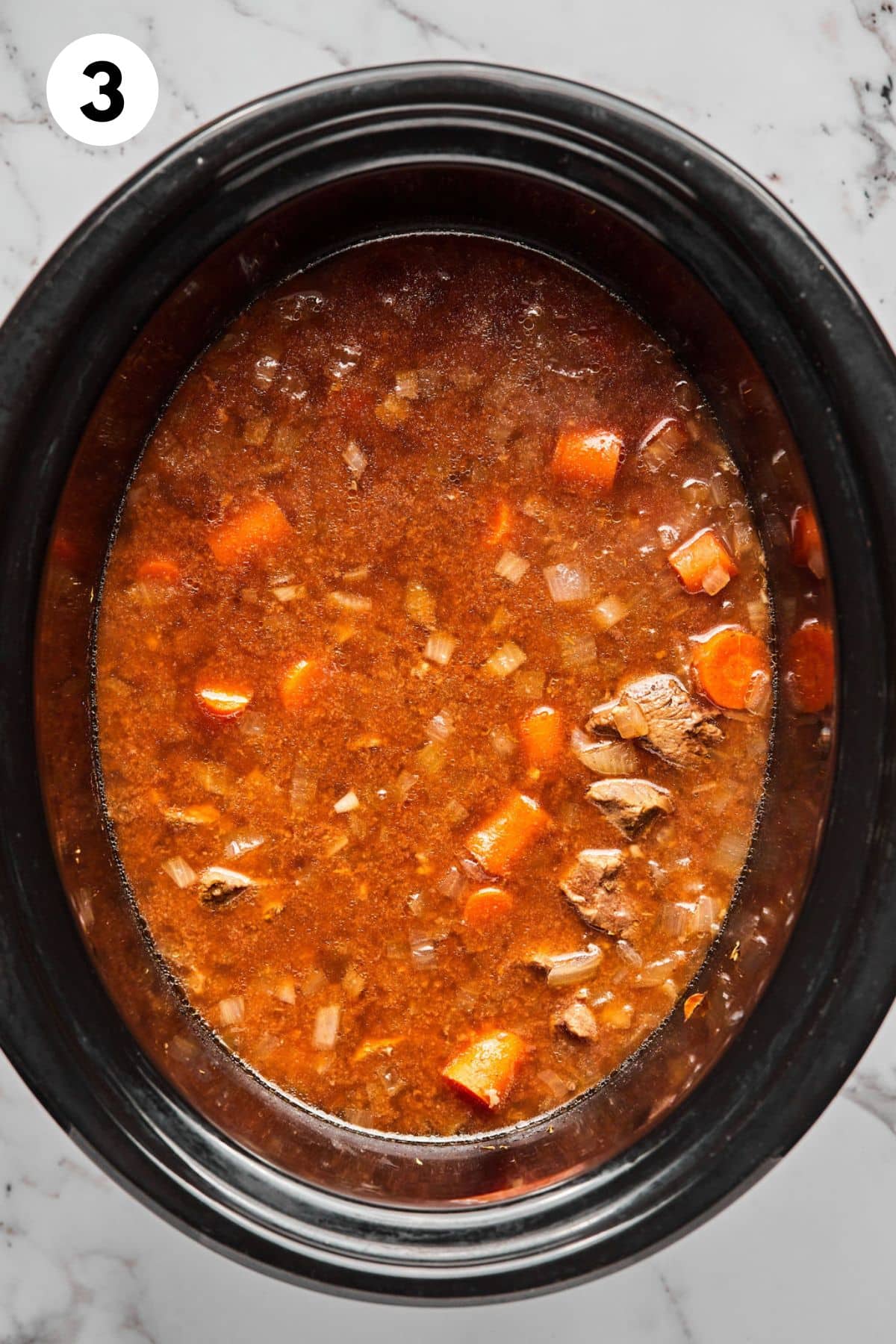 Beef stew ingredients mixed together and ready to cook. 