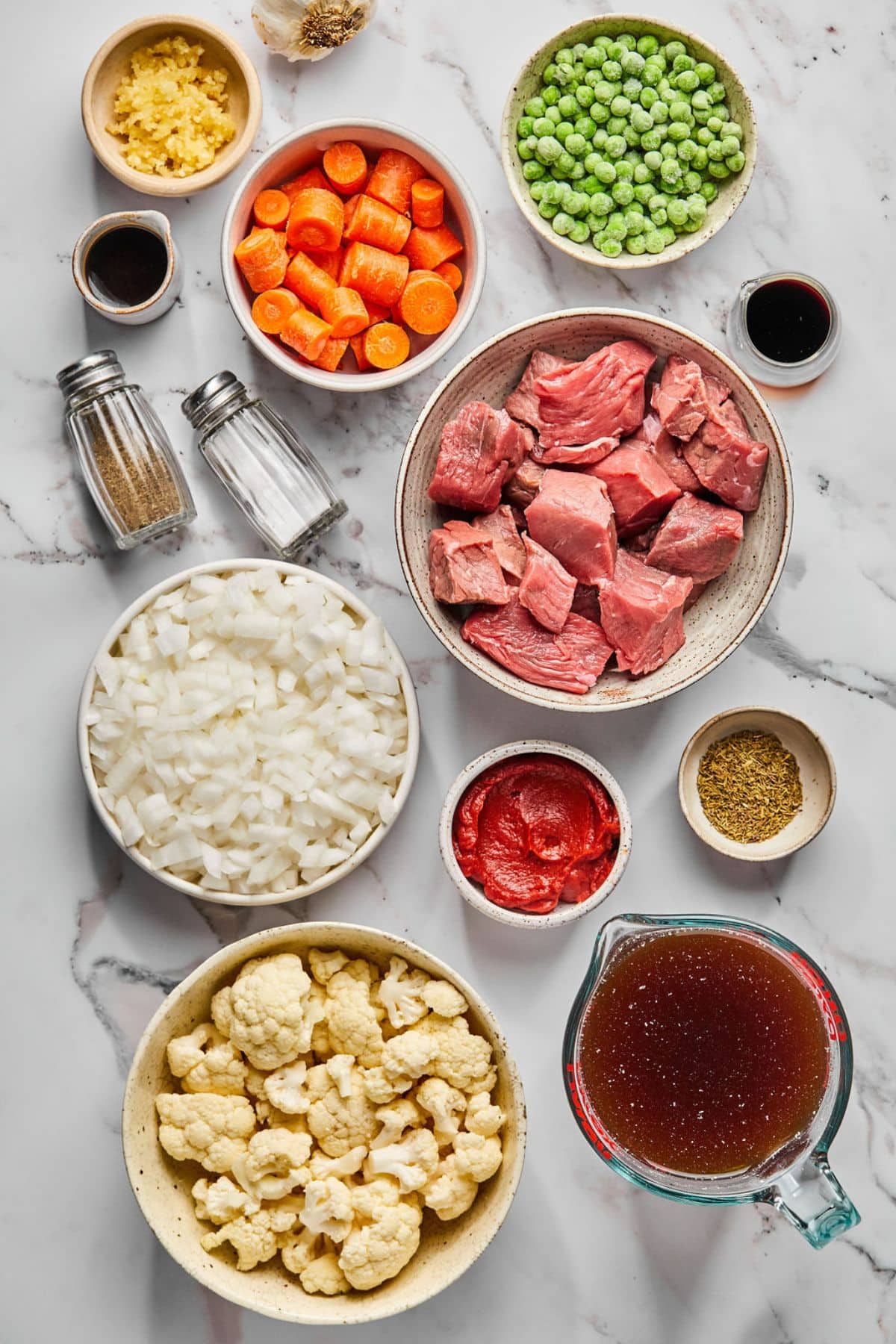 Ingredients to make healthy beef stew on the counter before preparing.