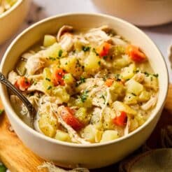 A bowl of healthy chicken pot pie soup on the table.