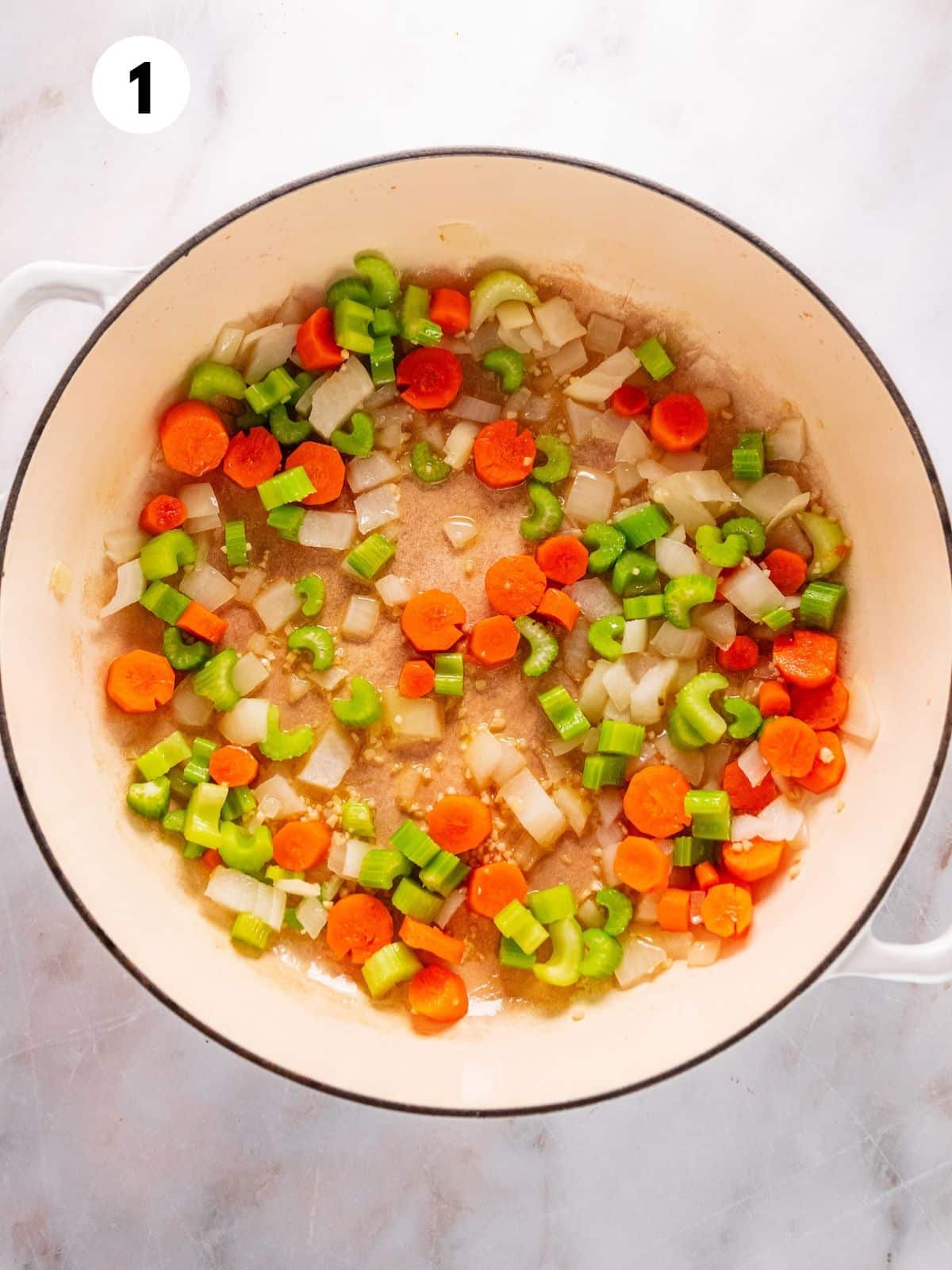 Chopped veggies for making this wild rice soup in a pot.