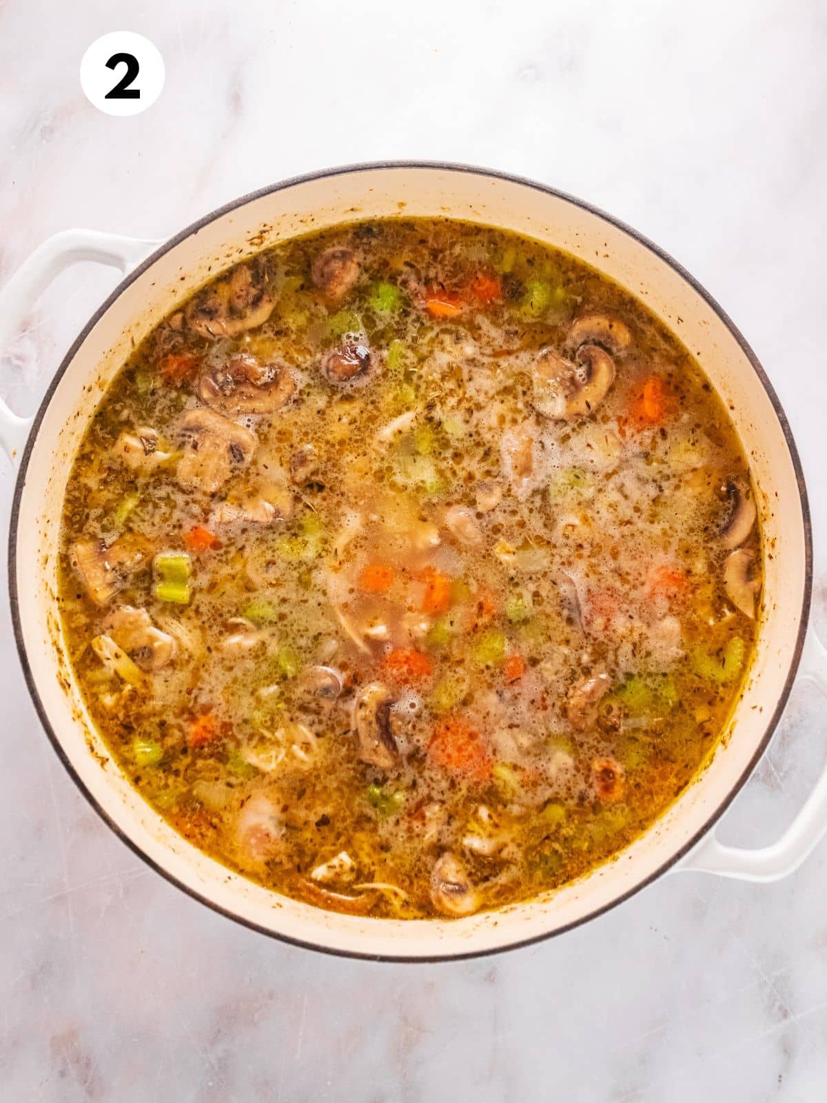 All of the ingredients for making this soup mixed together in a pot.
