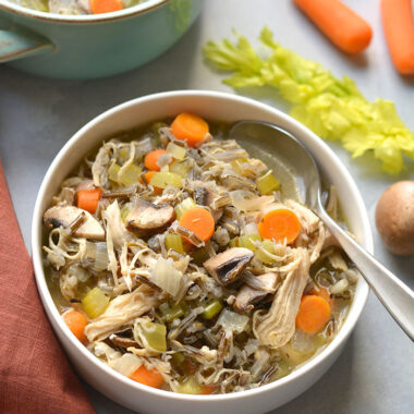 Healthy Turkey Wild Rice Soup is perfect for Thanksgiving leftover turkey! A low calorie meal that's naturally gluten free and veggie packed. Low Calorie + Gluten Free