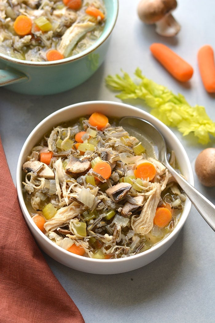 Healthy Turkey Wild Rice Soup is perfect for Thanksgiving leftover turkey! A low calorie meal that's naturally gluten free and veggie packed. Low Calorie + Gluten Free