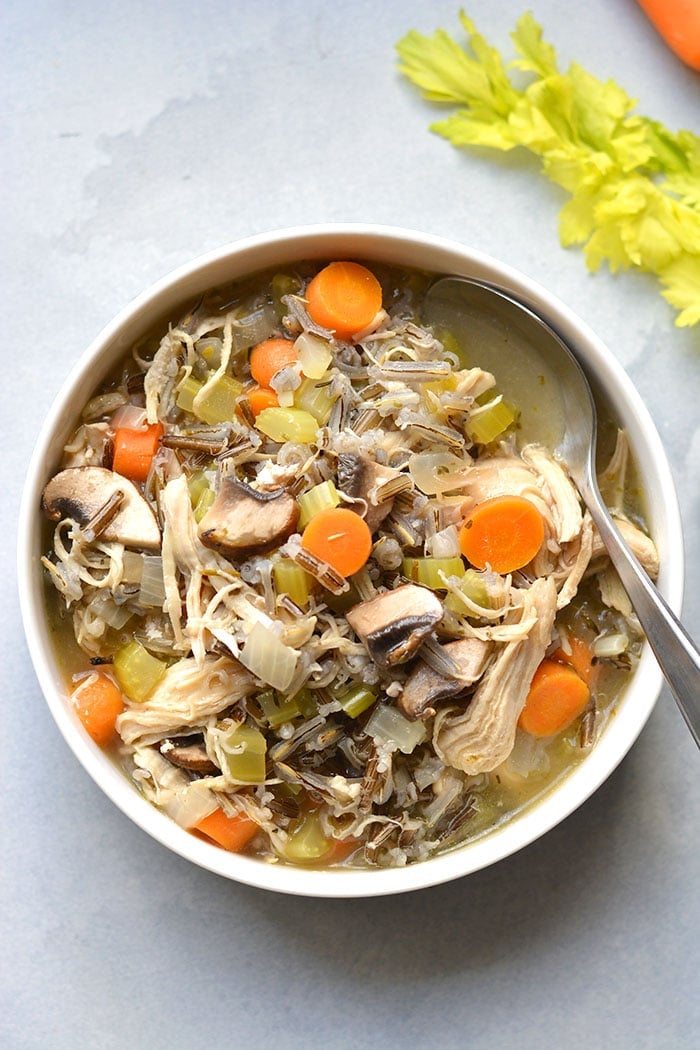 Healthy Turkey Wild Rice Soup is perfect for Thanksgiving leftover turkey! A low calorie meal that's naturally gluten free and veggie packed. Low Calorie + Gluten Free