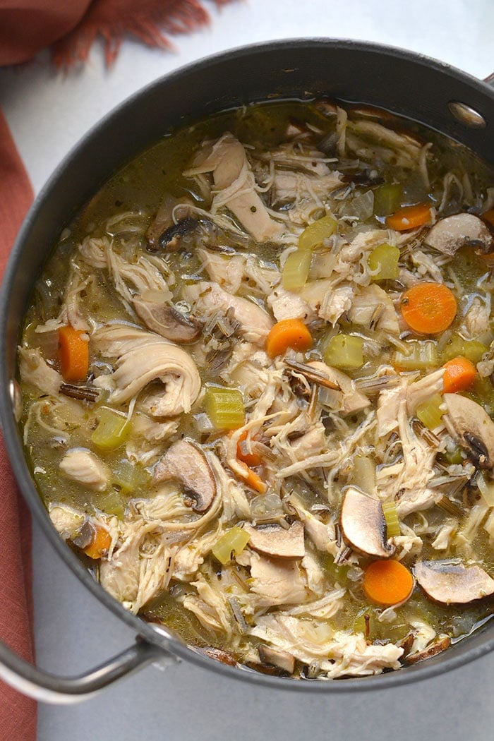 Healthy Turkey Wild Rice Soup is perfect for Thanksgiving leftover turkey! A low calorie meal that's naturally gluten free and veggie packed. Low Calorie + Gluten Free