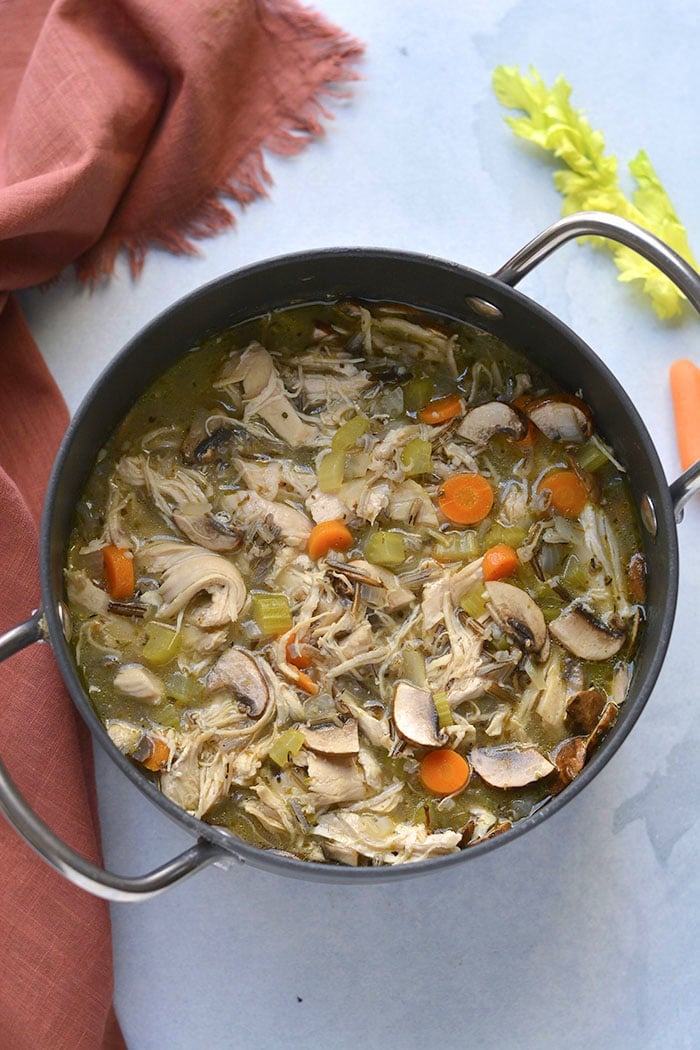 Healthy Turkey Wild Rice Soup is perfect for Thanksgiving leftover turkey! A low calorie meal that's naturally gluten free and veggie packed. Low Calorie + Gluten Free