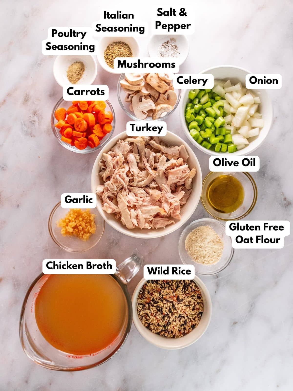 Ingredients for making turkey and wild rice soup in bowls.