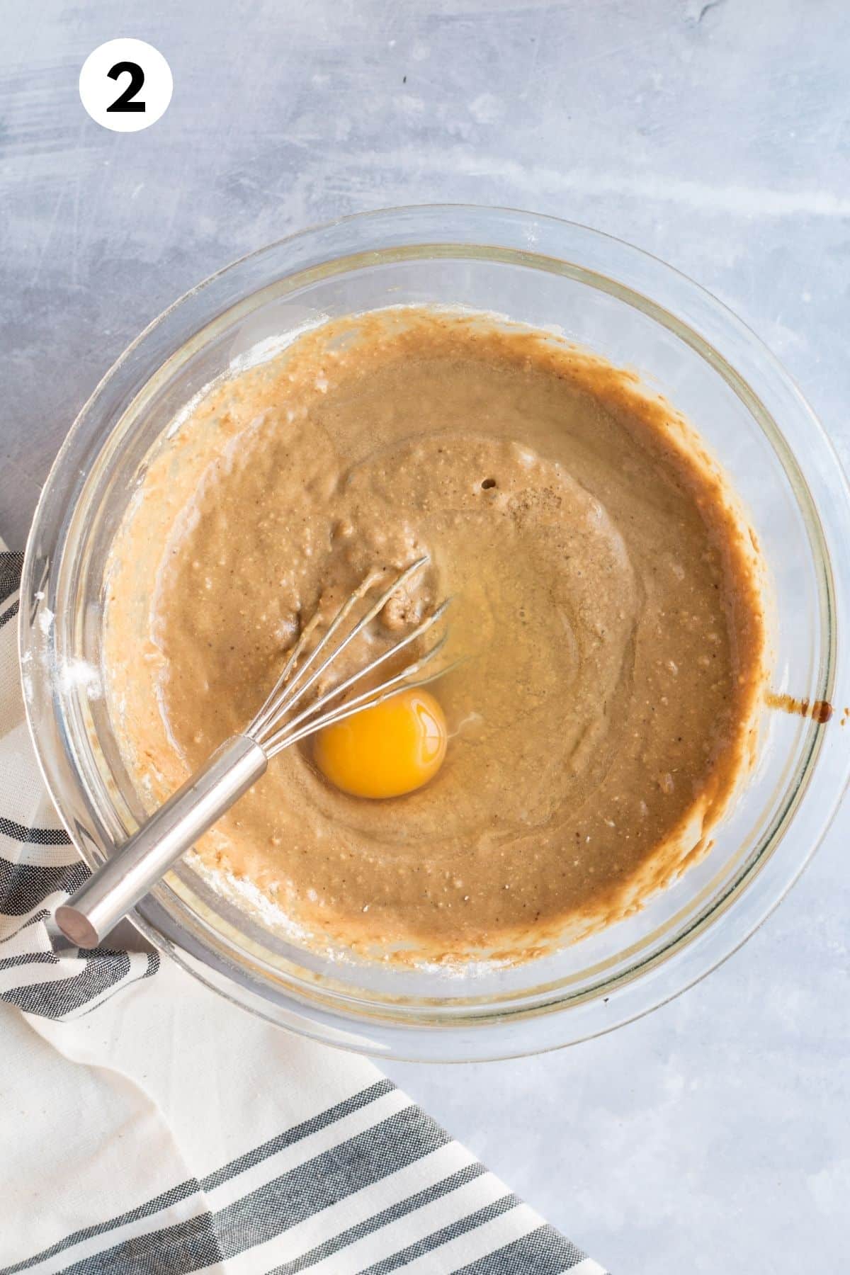 Wet ingredients mixed with the dry ingredients together in a bowl.