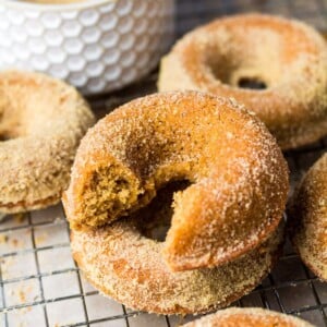 Gingerbread donuts on a cooling rack.