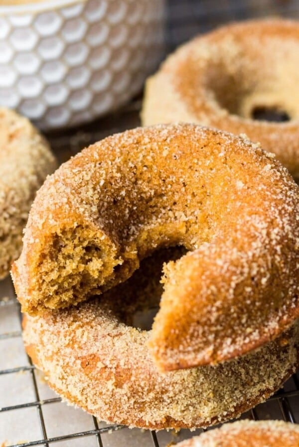 Gingerbread donuts on a cooling rack.