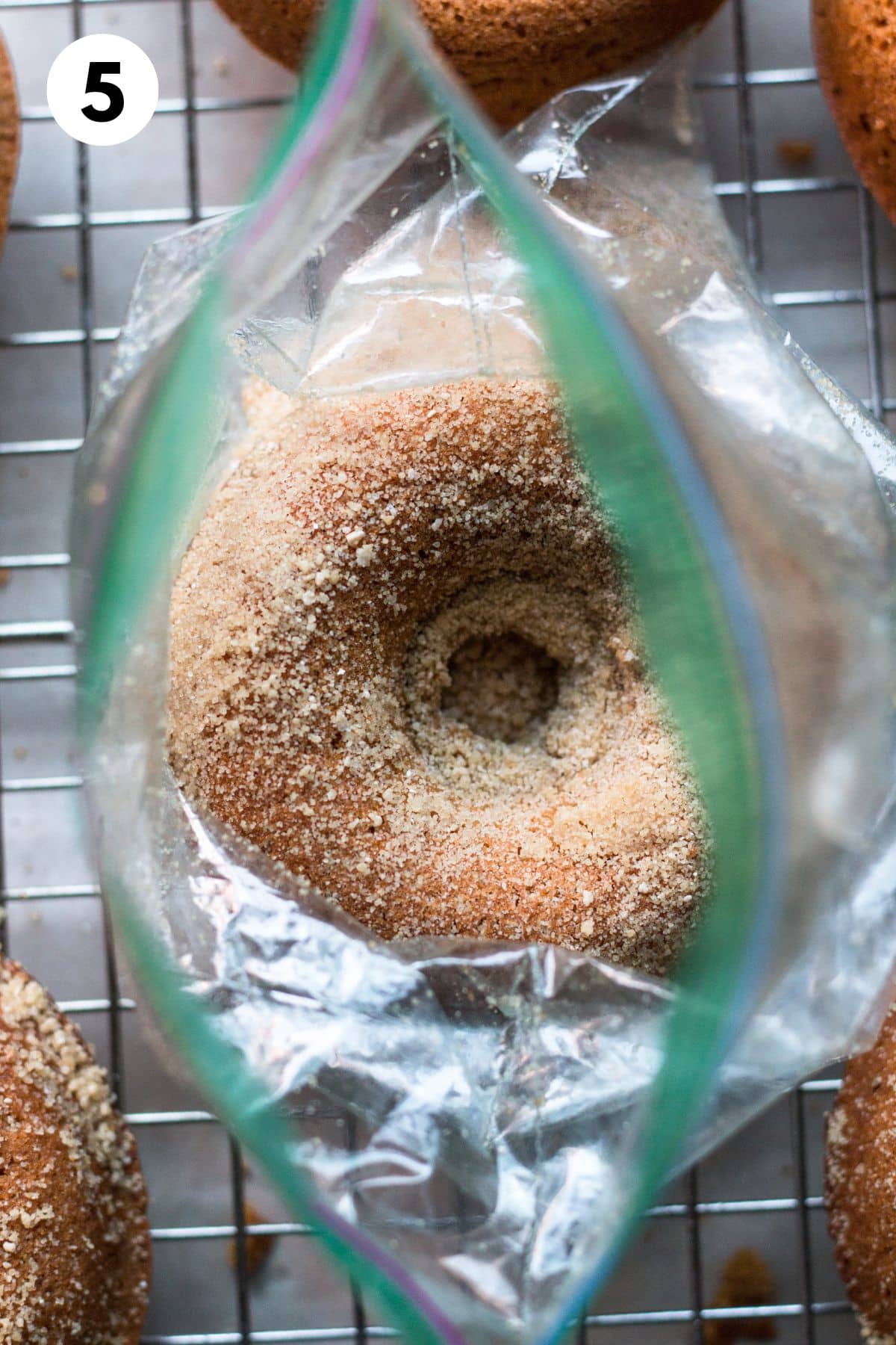A donut in a bag of maple sugar.