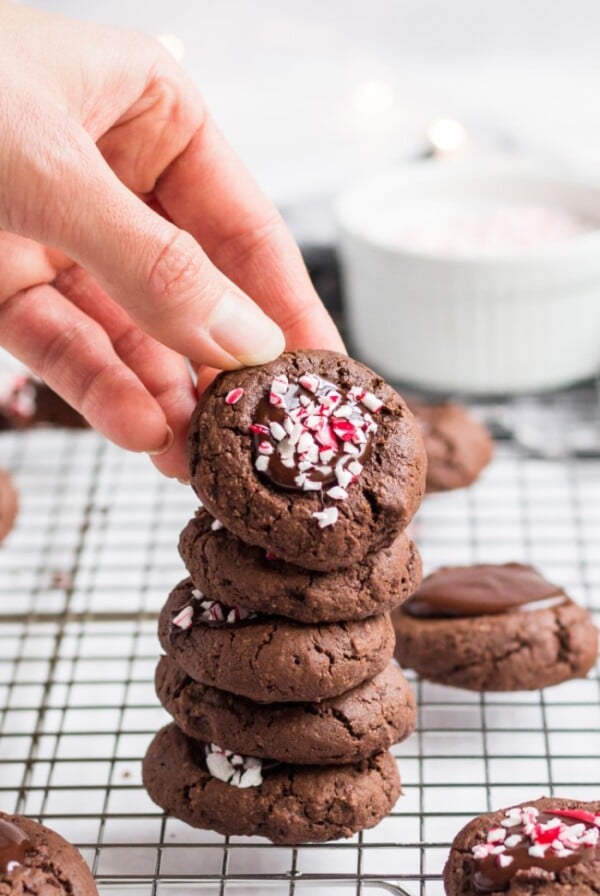 Healthy Chocolate Thumbprint Cookies made low calorie and gluten free are a delicious holiday cookie recipe with peppermint sprinkles on top! Gluten Free + Low Calorie