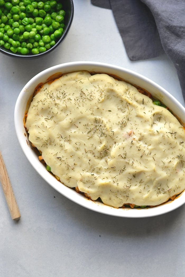 Healthy Shepherd's Pie is a low calorie recipe that's lower in carbs, high in protein and fiber. Made with a delicious roasted garlic cauliflower top and a lighter filling a for a filling and comforting winter meal. Low Calorie + Gluten Free + Low Carb + Paleo
