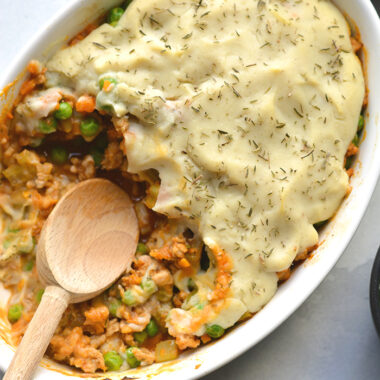 Healthy Shepherd's Pie is a low calorie recipe that's lower in carbs, high in protein and fiber. Made with a delicious roasted garlic cauliflower top and a lighter filling a for a filling and comforting winter meal. Low Calorie + Gluten Free + Paleo