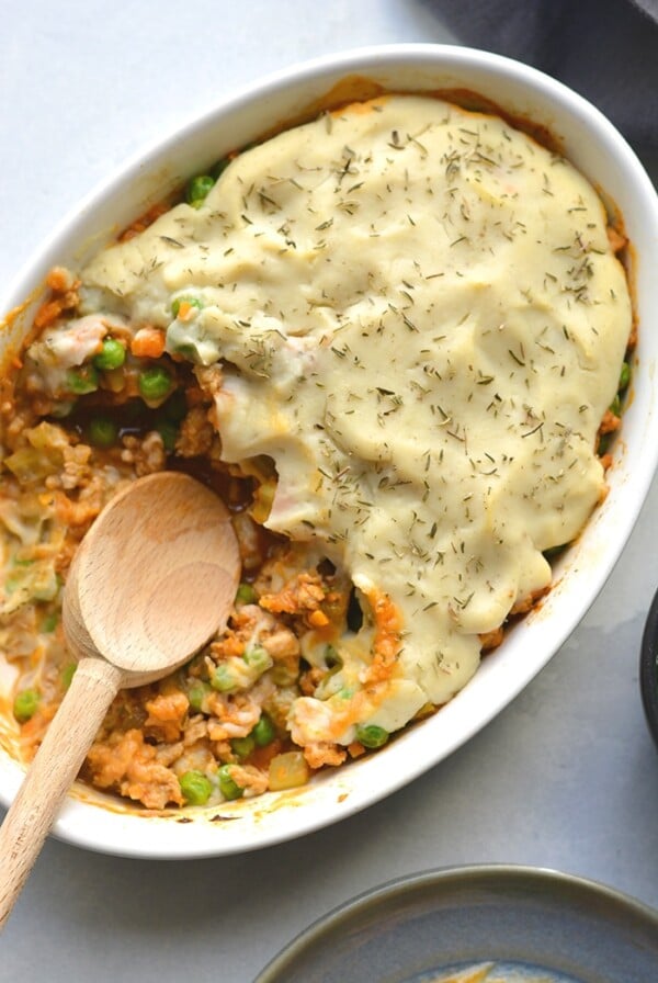 Healthy Shepherd's Pie is a low calorie recipe that's lower in carbs, high in protein and fiber. Made with a delicious roasted garlic cauliflower top and a lighter filling a for a filling and comforting winter meal. Low Calorie + Gluten Free + Paleo