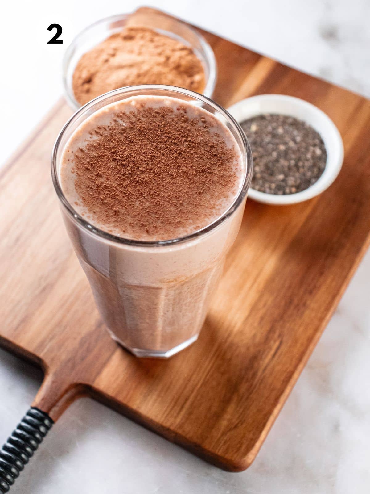 Hot chocolate smoothie after blending and pouring in a glass.