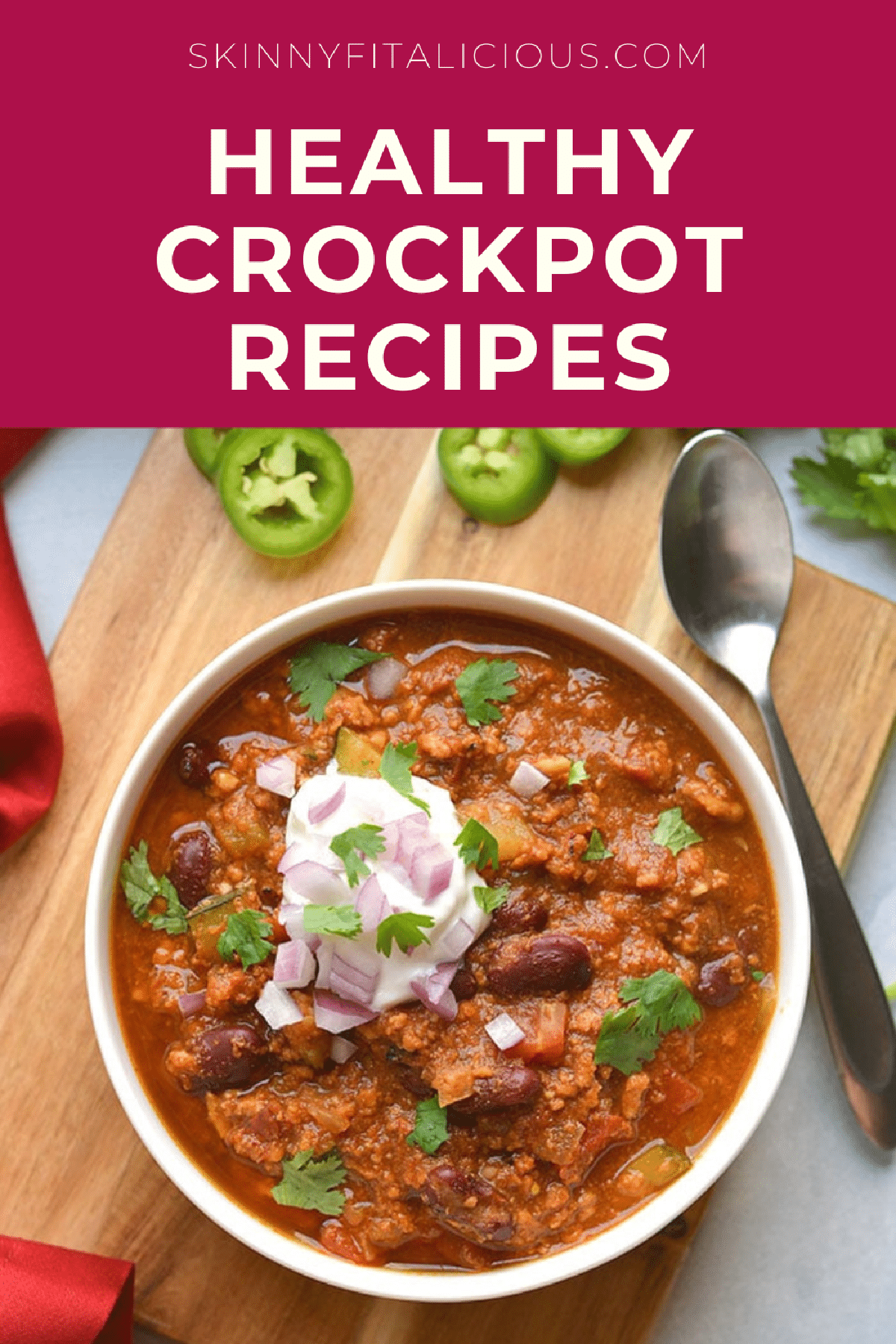 bowl of chili in a white bowl with yogurt on top.