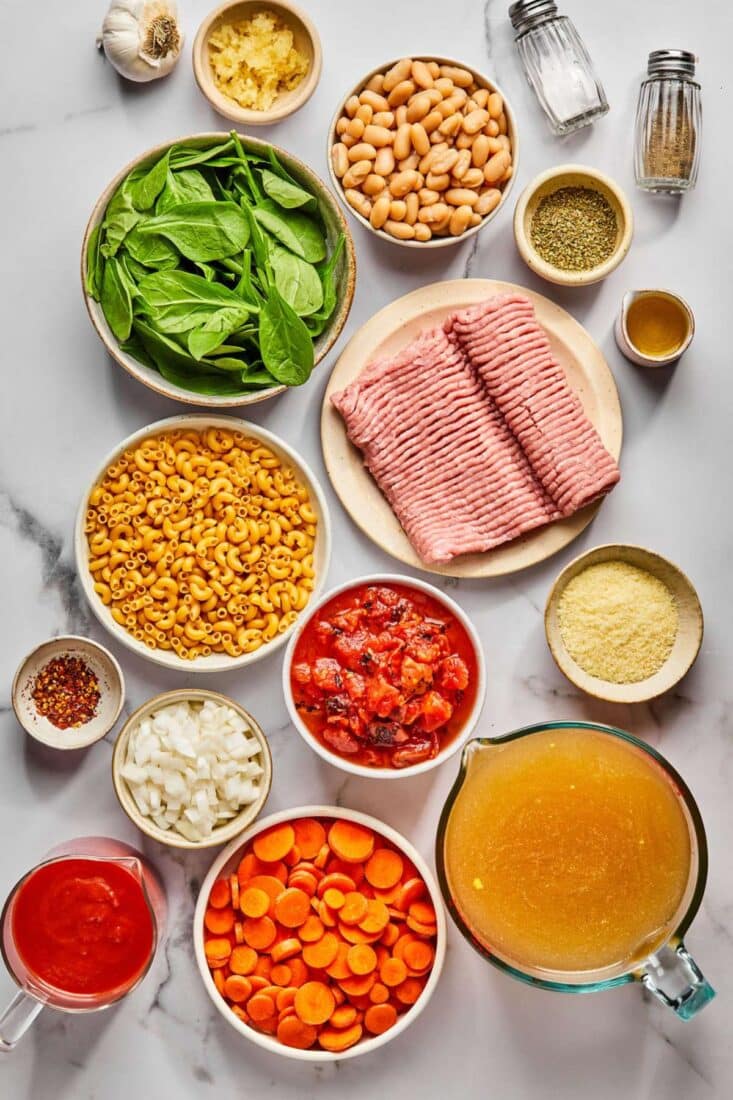 Ingredients to make pasta e fagioli on the table before preparing.