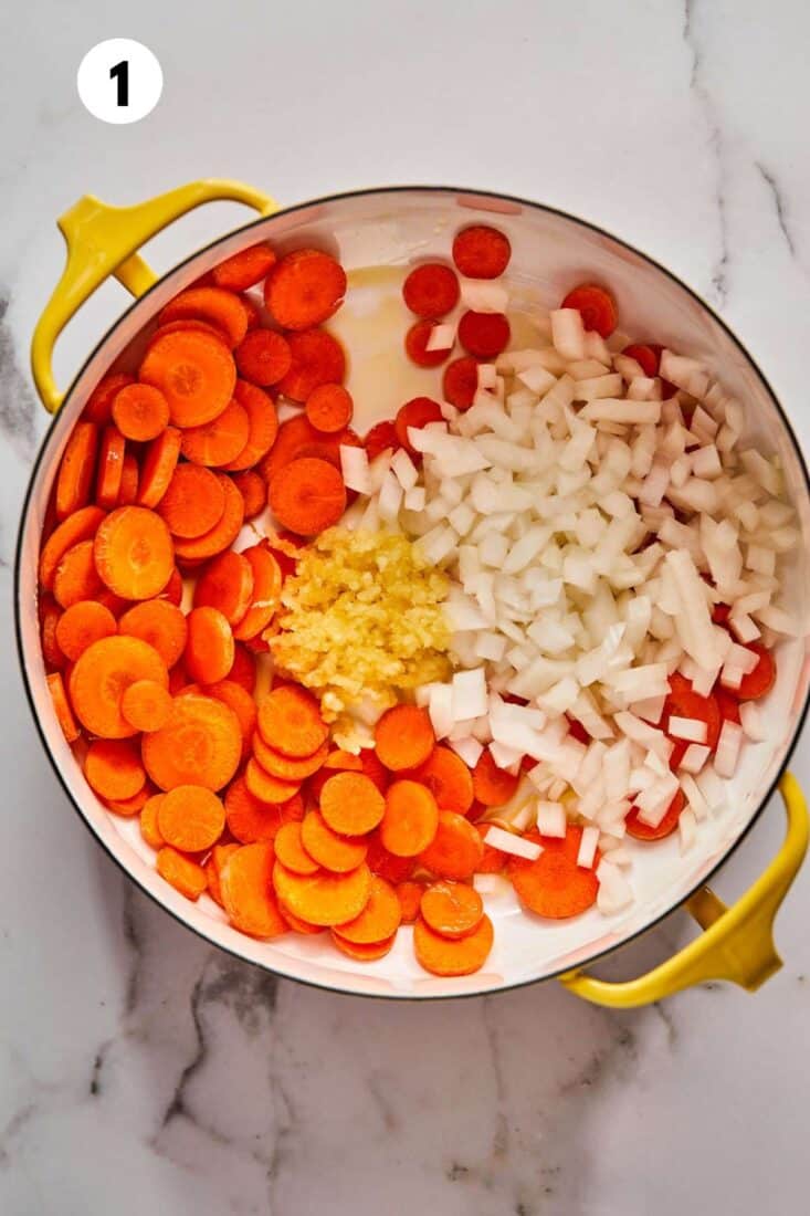 Vegetables added to a Dutch oven to cook.