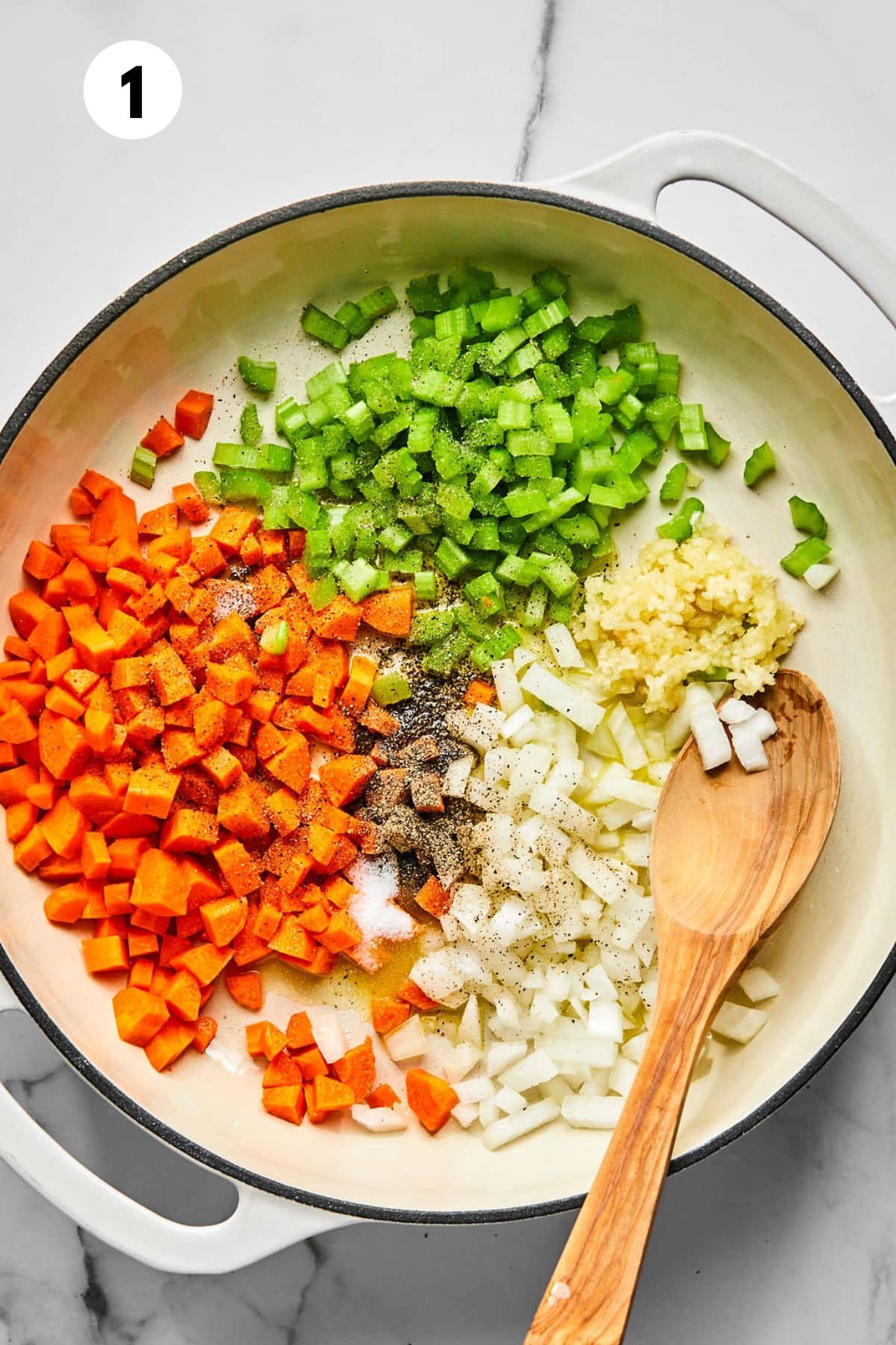 Chopped vegetables cooking in a skillet.