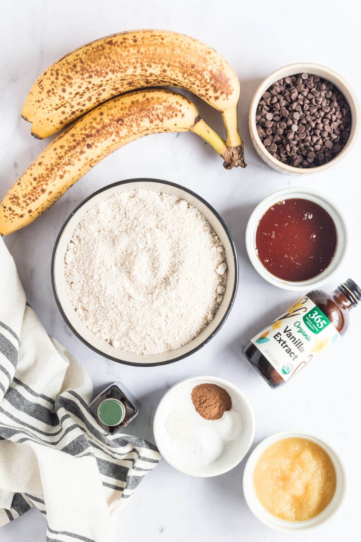 Ingredients to make banana oat bread on the table before mixing.