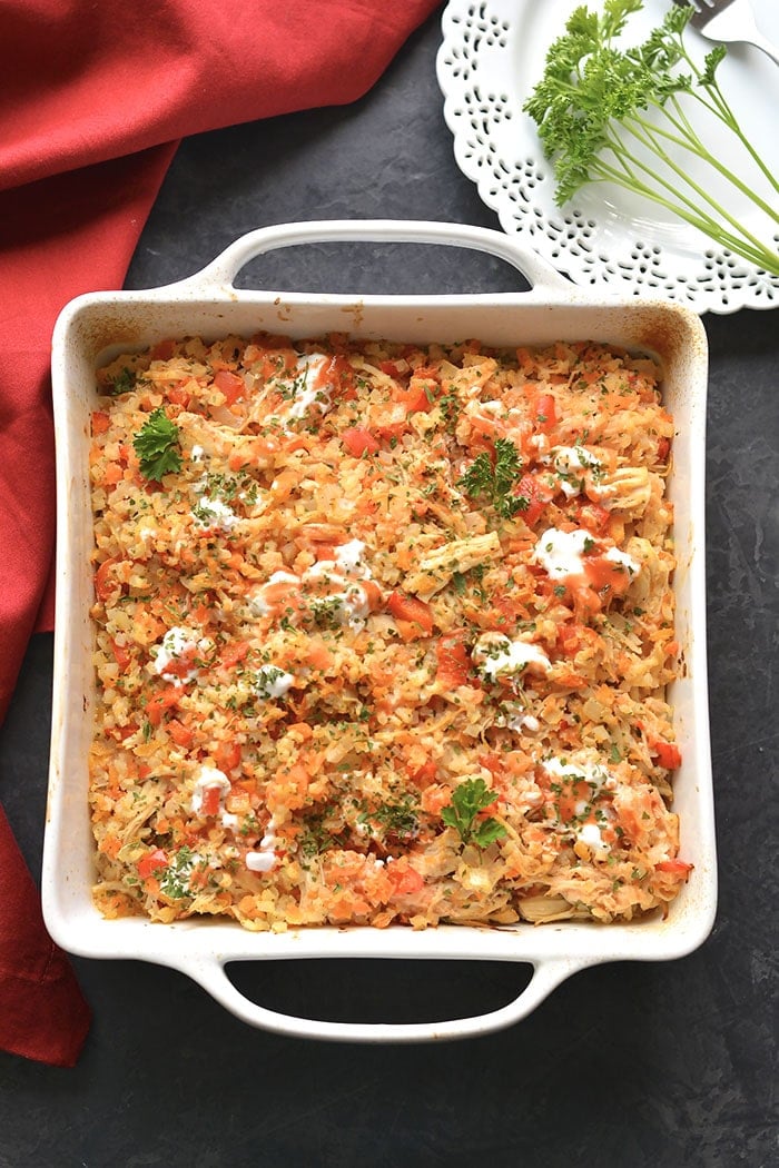 Healthy Buffalo Chicken Casserole is baked buffalo chicken recipe with cauliflower rice. A super simple and delicious one pan meal that is low calorie, low carb, gluten free, Paleo and Whole30 friendly.