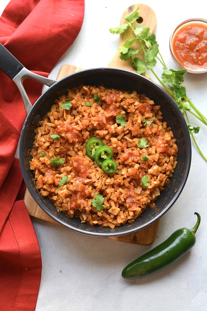 Healthy Mexican Cauliflower Rice is a low calorie, low carb dish made in one skillet with just a few ingredients. A healthy side dish recipe you can add to a meal, soups, salads and more!