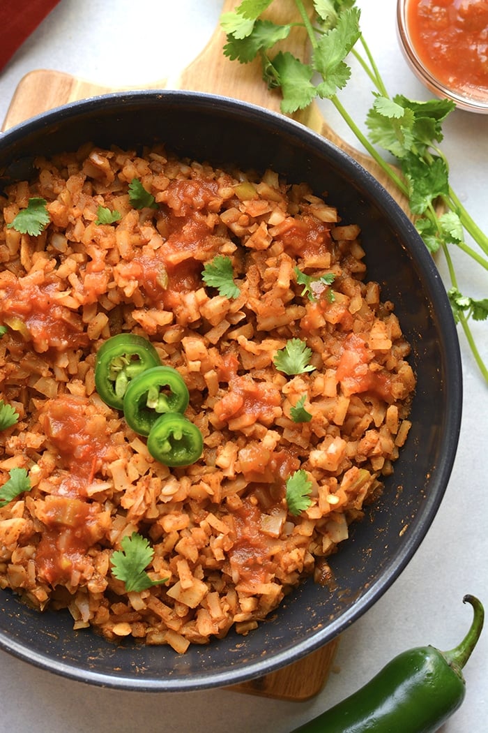 Healthy Mexican Cauliflower Rice is a low calorie, low carb dish made in one skillet with just a few ingredients. A healthy side dish recipe you can add to a meal, soups, salads and more!