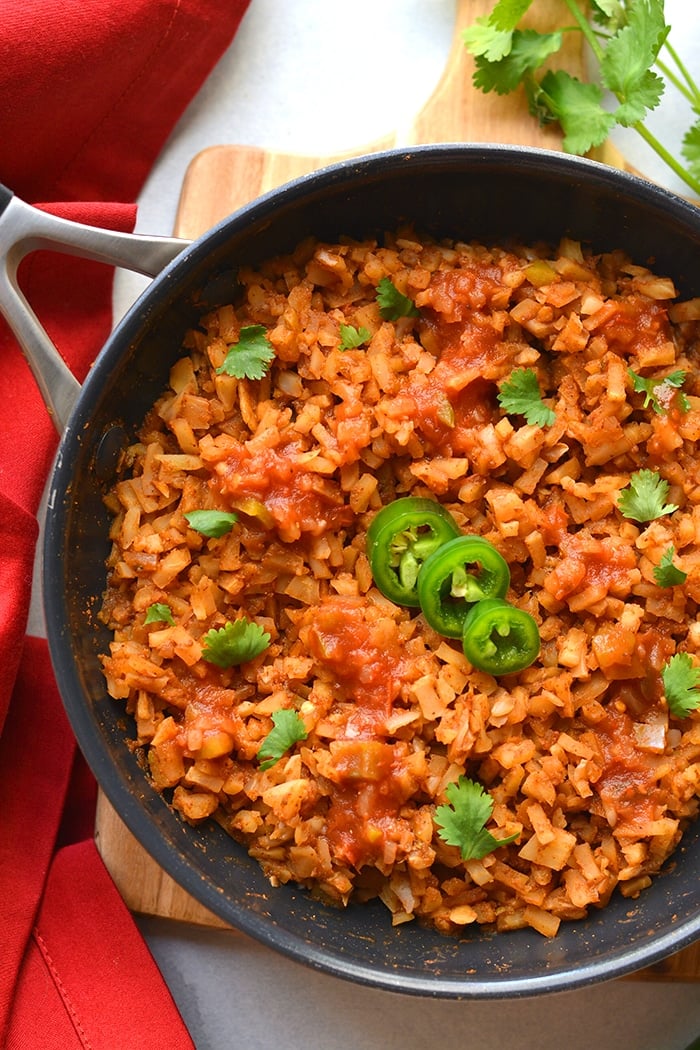 Healthy Mexican Cauliflower Rice is a low calorie, low carb dish made in one skillet with just a few ingredients. A healthy side dish recipe you can add to a meal, soups, salads and more!