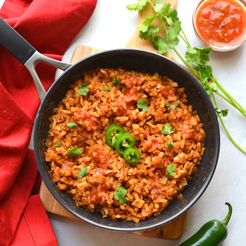 Healthy Mexican Cauliflower Rice is a low calorie, low carb dish made in one skillet with just a few ingredients. A healthy side dish recipe you can add to a meal, soups, salads and more!