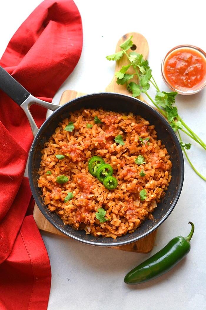 Healthy Mexican Cauliflower Rice is a low calorie, low carb dish made in one skillet with just a few ingredients. A healthy side dish recipe you can add to a meal, soups, salads and more!