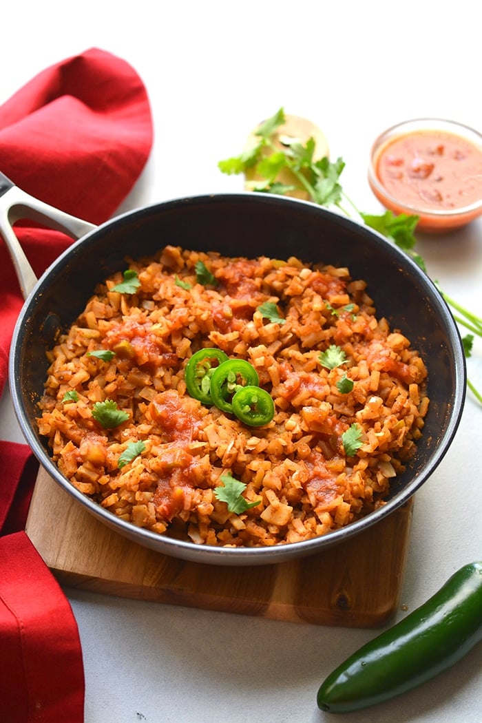 Healthy Mexican Cauliflower Rice is a low calorie, low carb dish made in one skillet with just a few ingredients. A healthy side dish recipe you can add to a meal, soups, salads and more!