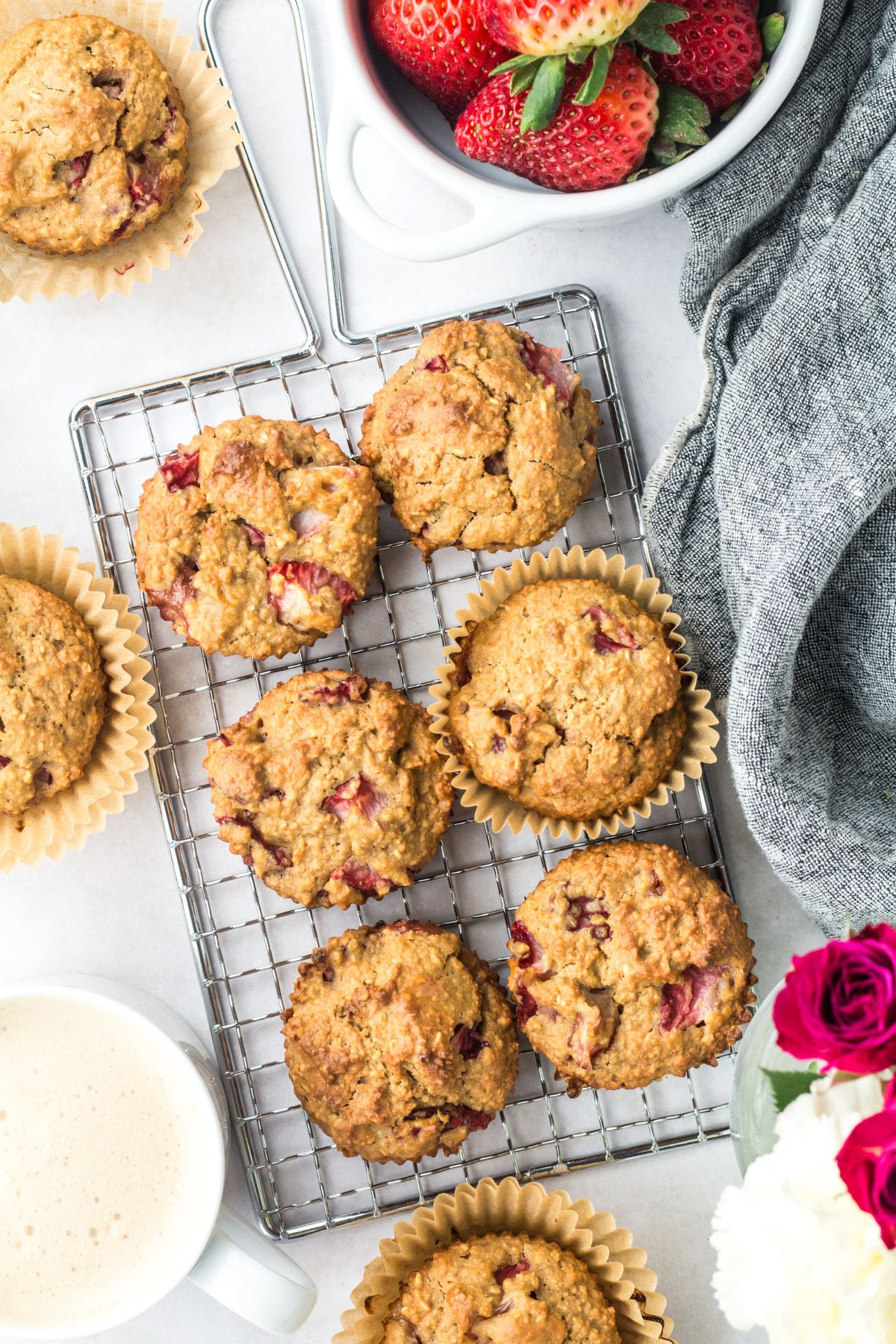 Strawberry protein muffins on a cooling rack.