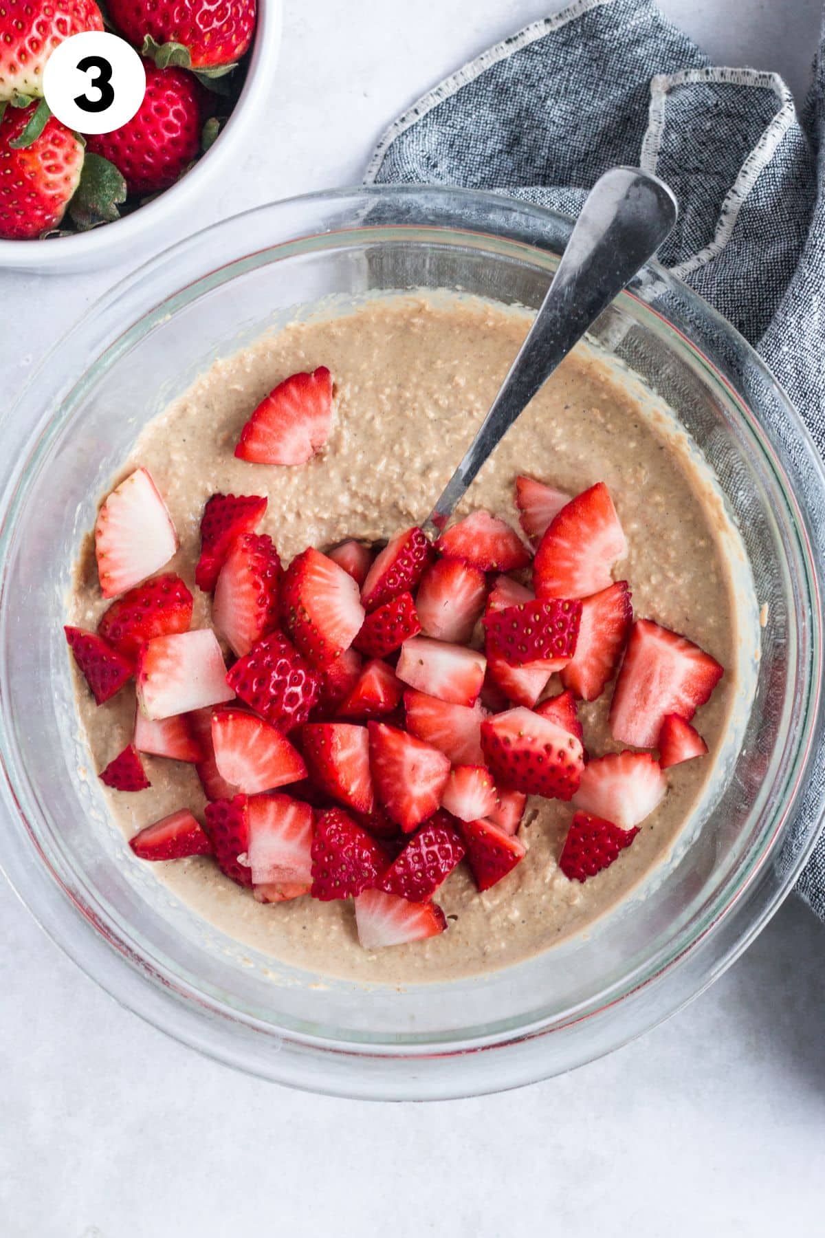 The batter blended with cut strawberries added.